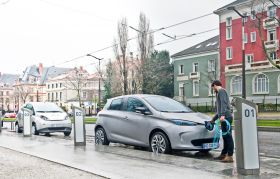 Why is improving the charging network important to boost electric vehicles' sales? 